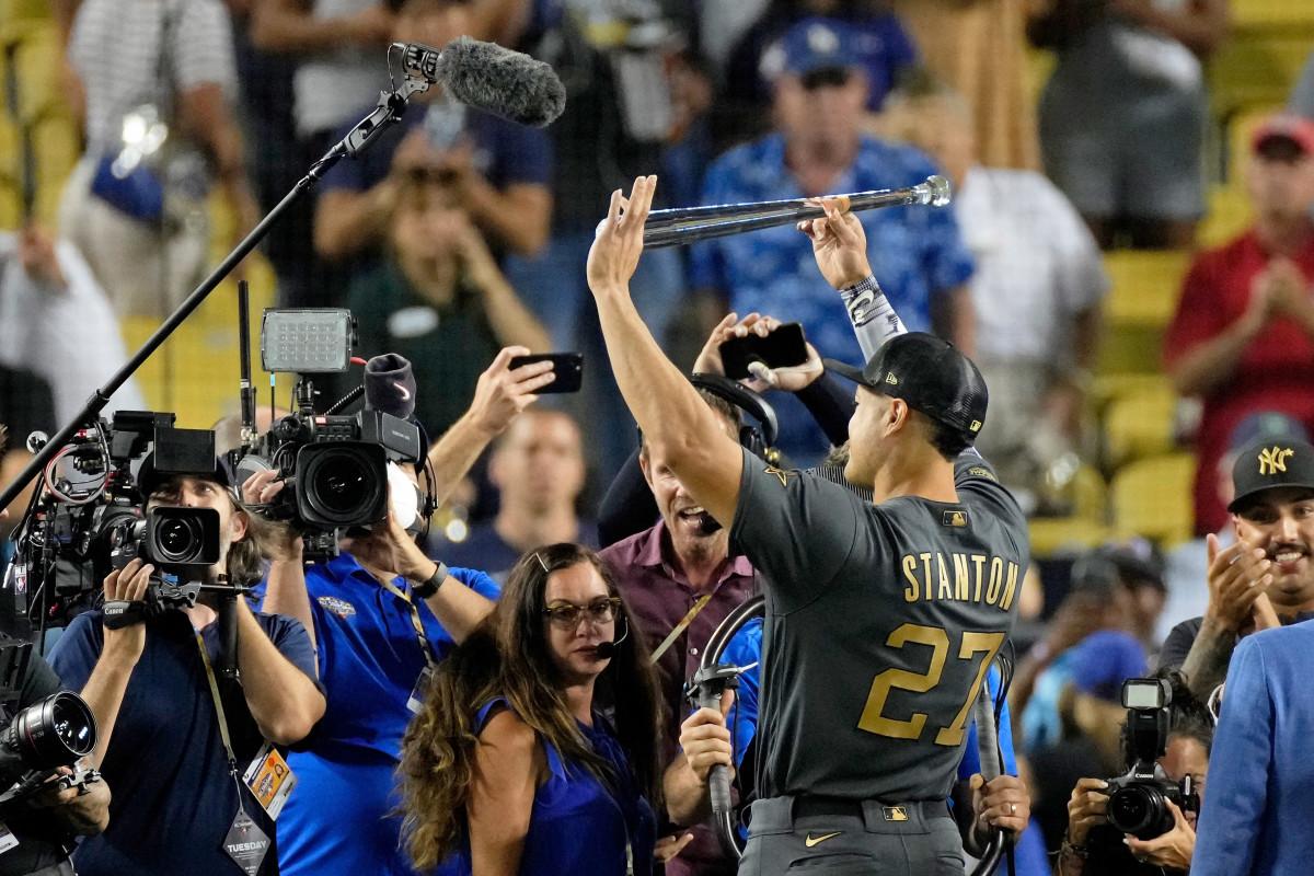 Giancarlo Stanton holds up the MVP award.